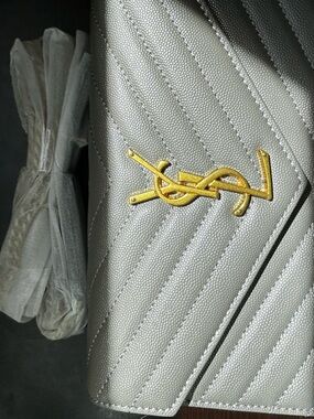 Saint Laurent Silver Quilted Coat with Gold YSL Emblem
